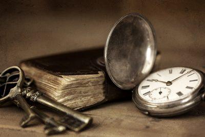 Keys, and old book, and a pocket watch
