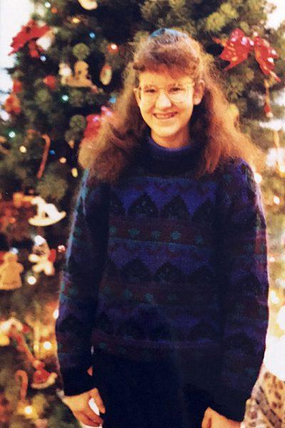 The author at age 14, wearing the sweater she references from her memory of fearing man more than God.